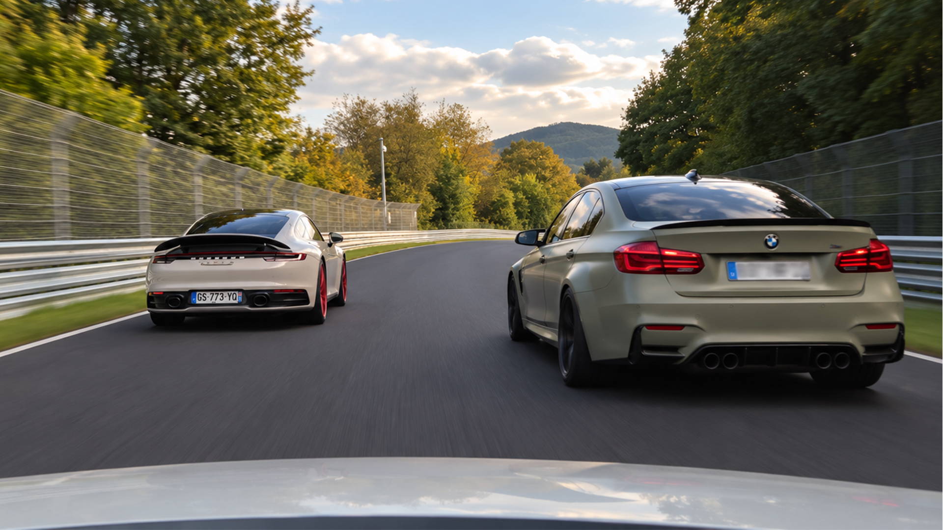 Porsche 911 draws level with a BMW M3