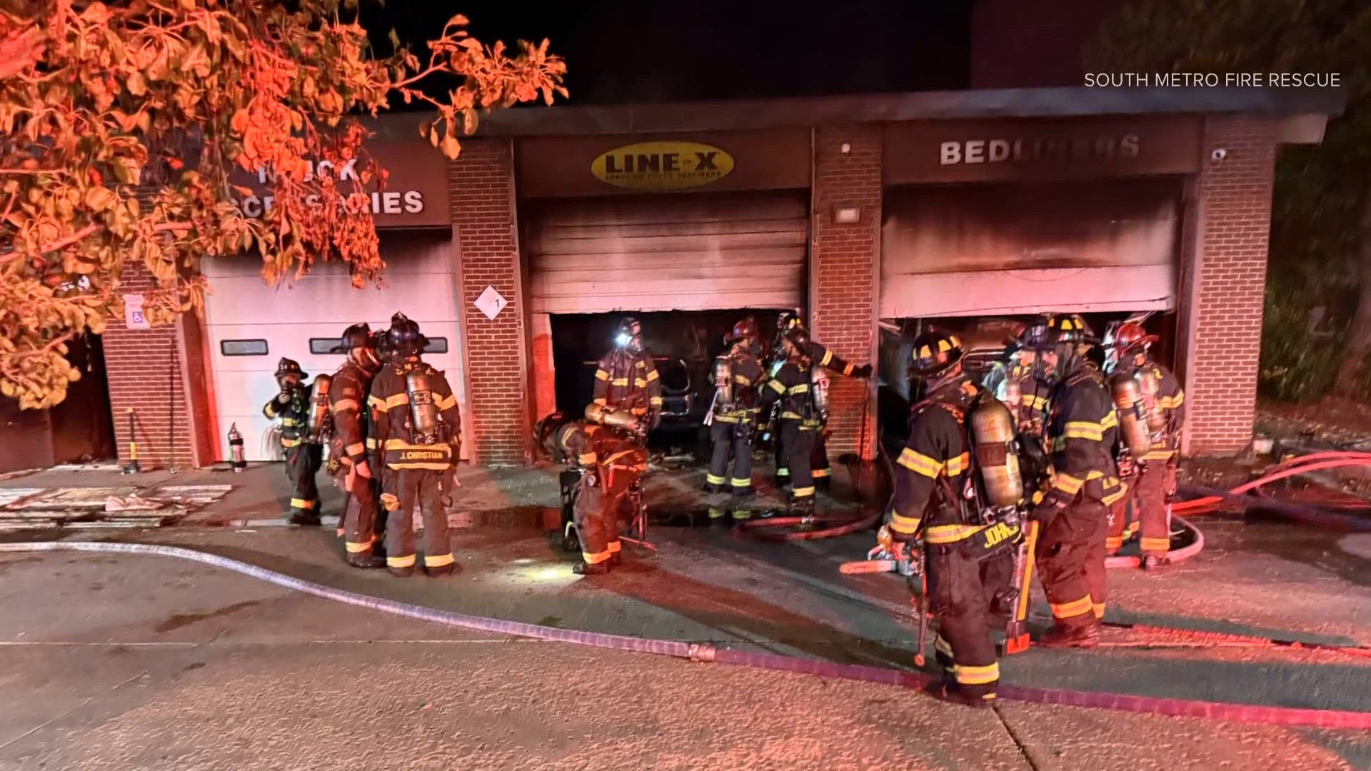 Crews battle fire at auto shop in Littleton