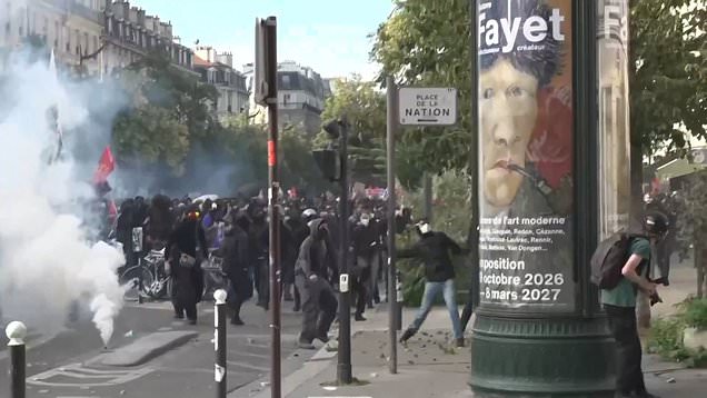 Protesters and police clash in Paris on biggest day of French student riots