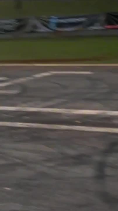 Drag racing car slams into starting light post