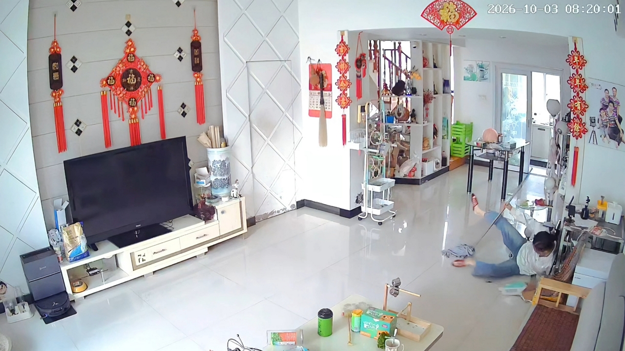 Woman slips on wet floor while cleaning in Hubei