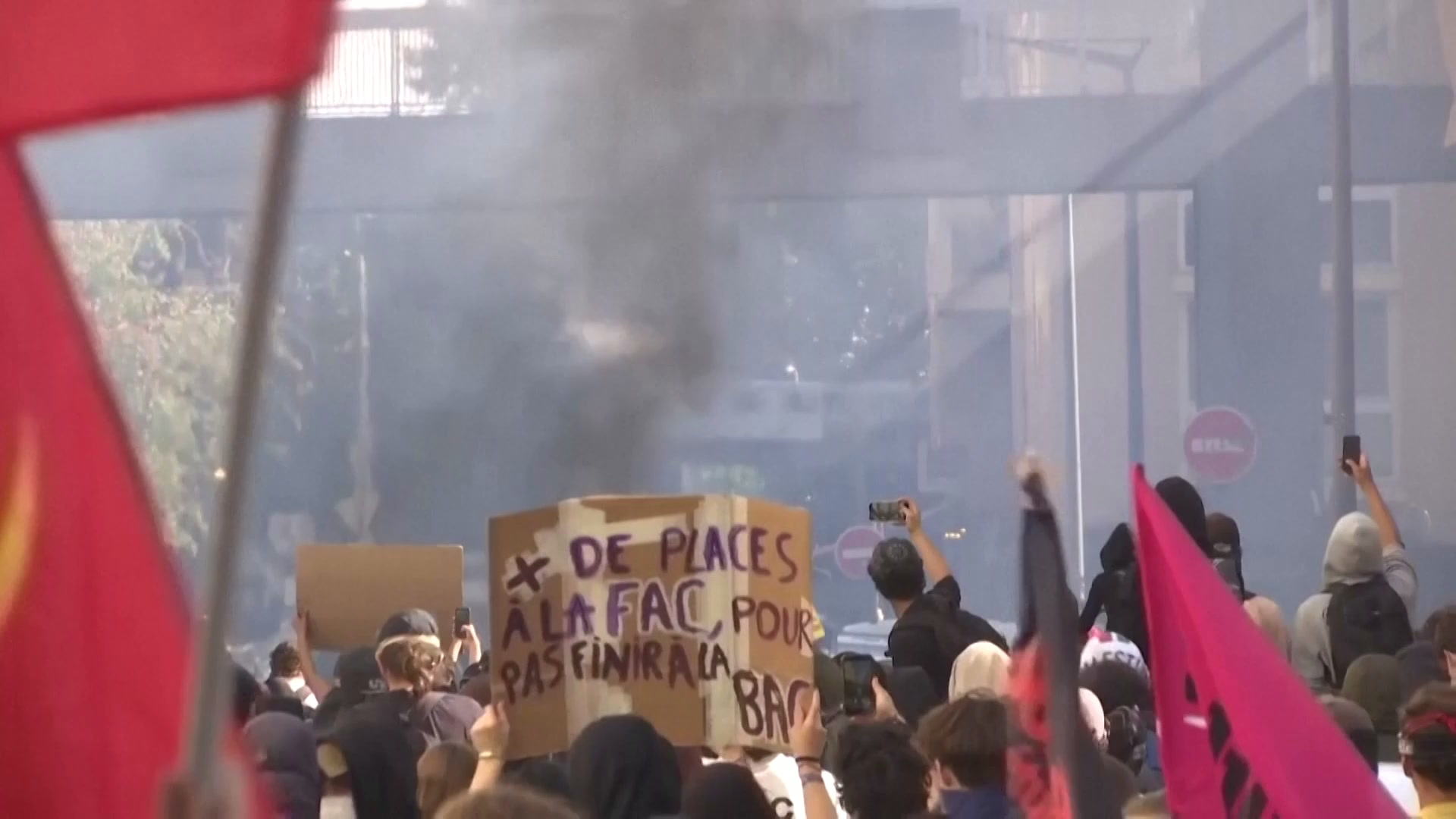 French student protesters cause chaos in streets, wave communist flags ...