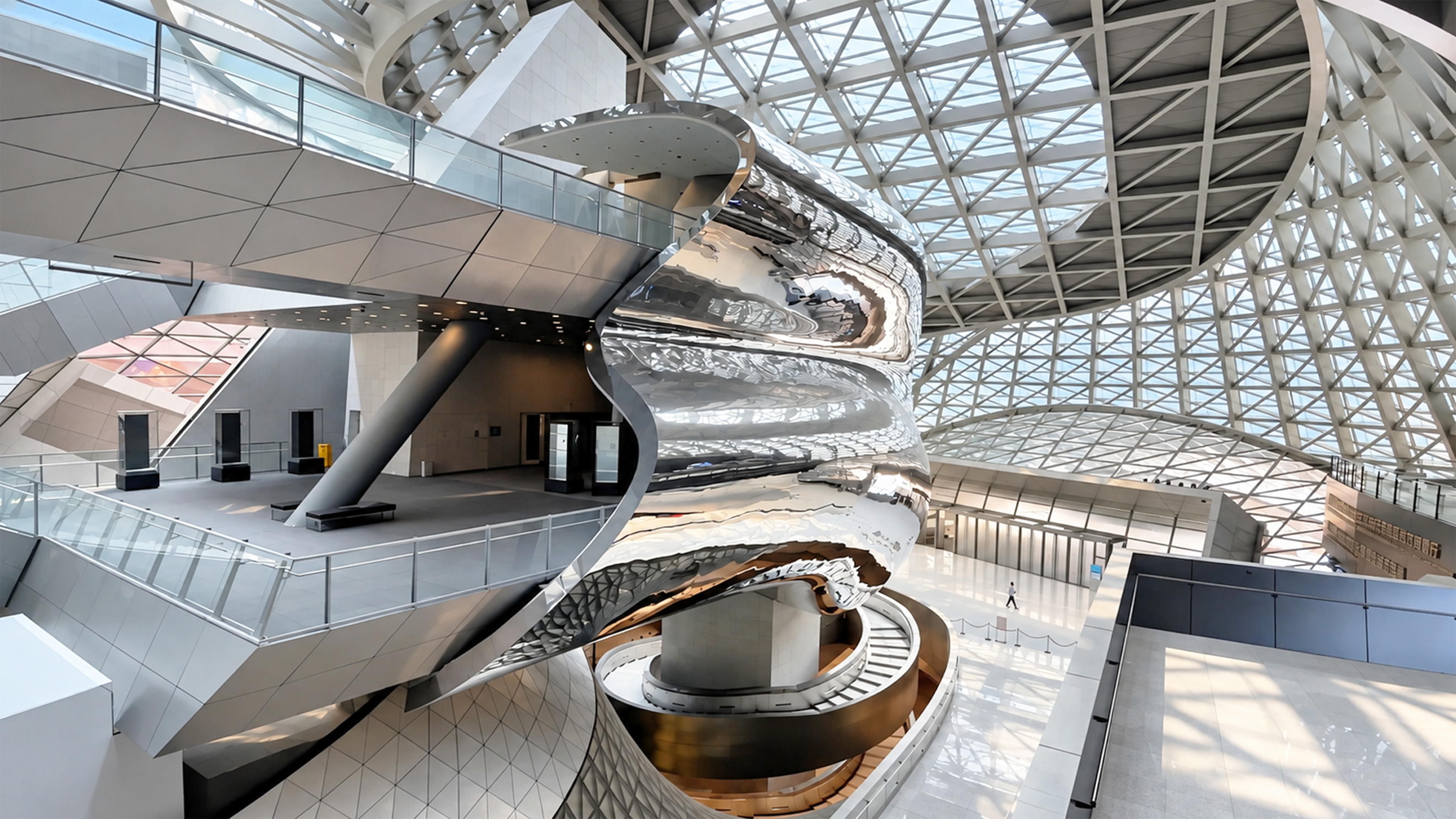 A twisting mirror structure dominates this futuristic hall in China