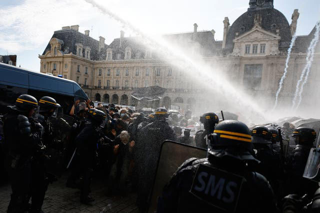 French riot police fire tear gas as more than 250,000 rally for school ...