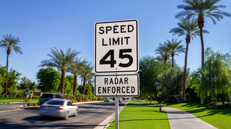 How far apart do speed limit signs need to be on the road?