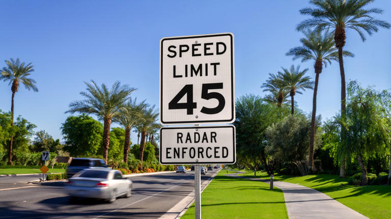 How far apart do speed limit signs need to be on the road?