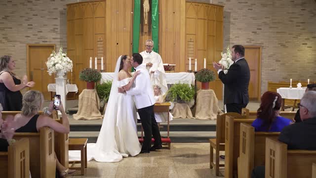 Flower girl expresses disapproval of couple's initial kiss at the altar