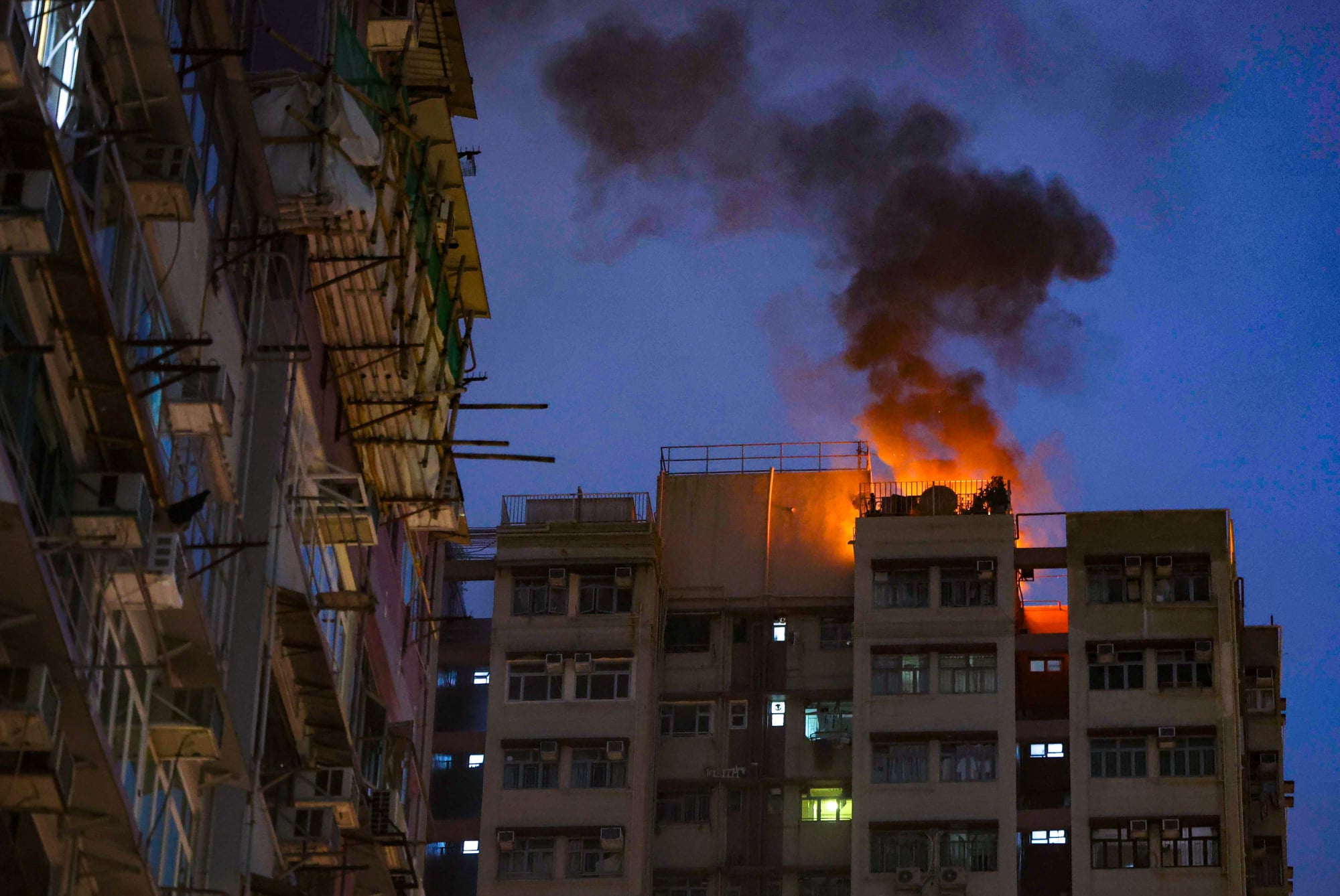 Fire breaks out on rooftop of residential building in Hong Kong's Mong Kok