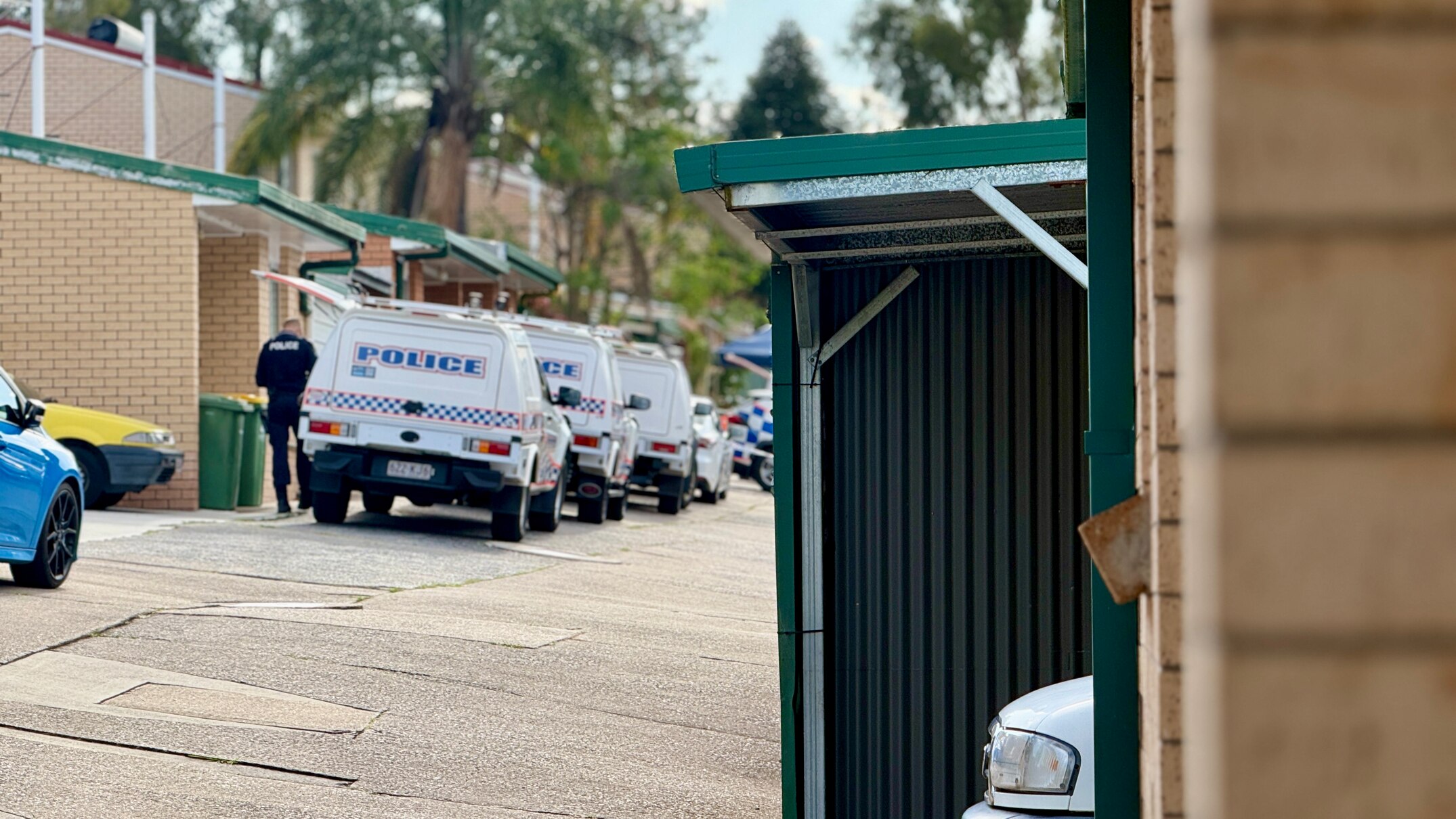 Man charged with murder after police find body in Woodridge unit