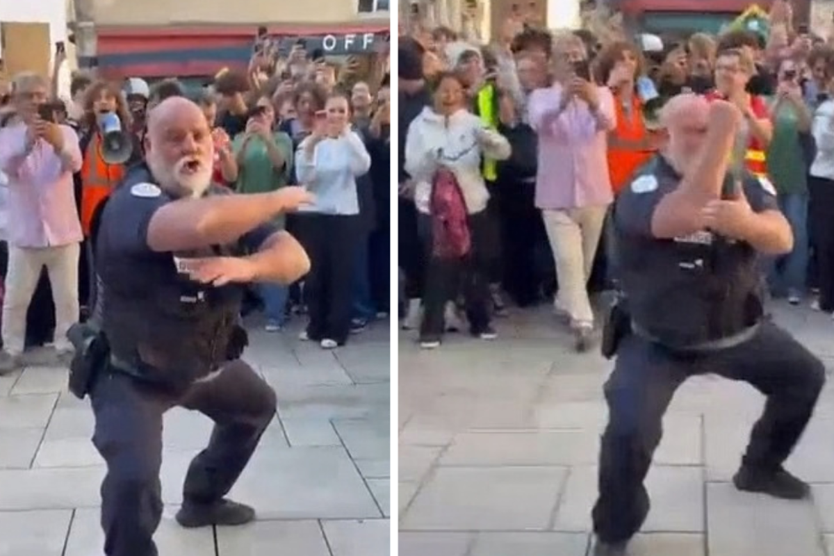 Police officer cheered by teenagers in French school protest
