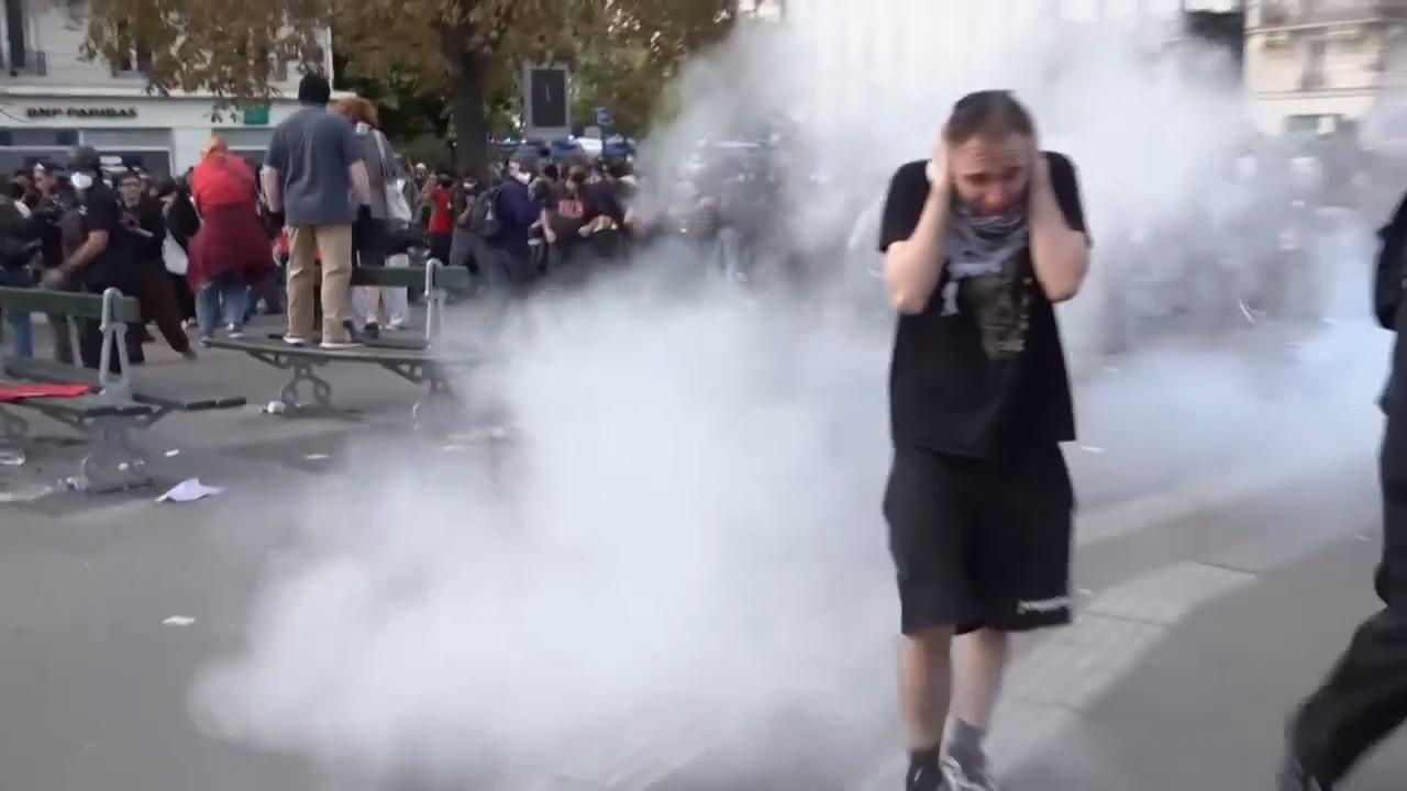 French riot police fire tear gas as thousands rally in Paris over ...