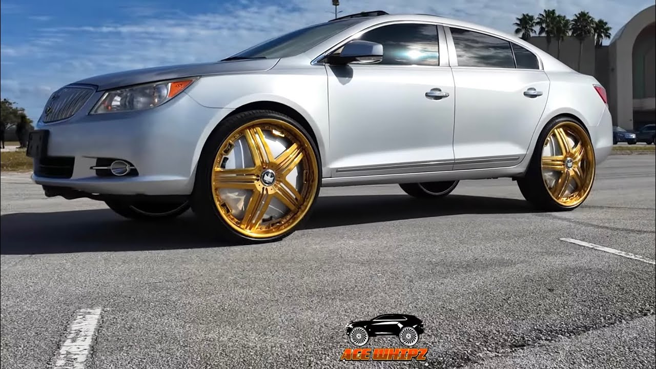 GoSoHardMitch's silver Buick Lacrosse on gold 26
