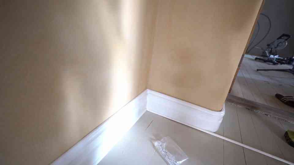 Installing floor trims and solving challenges in an uneven historic hallway