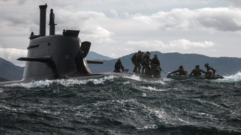 British commandos hitch a ride on German submarine during war exercise