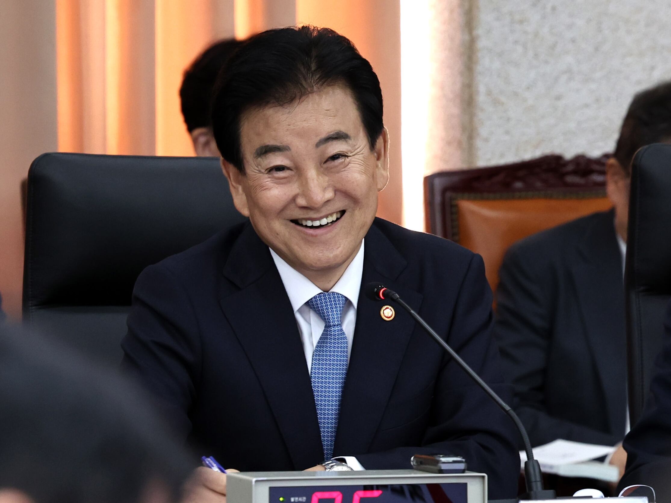 Unification minister's laughter sparks clash over North Korean defector ...