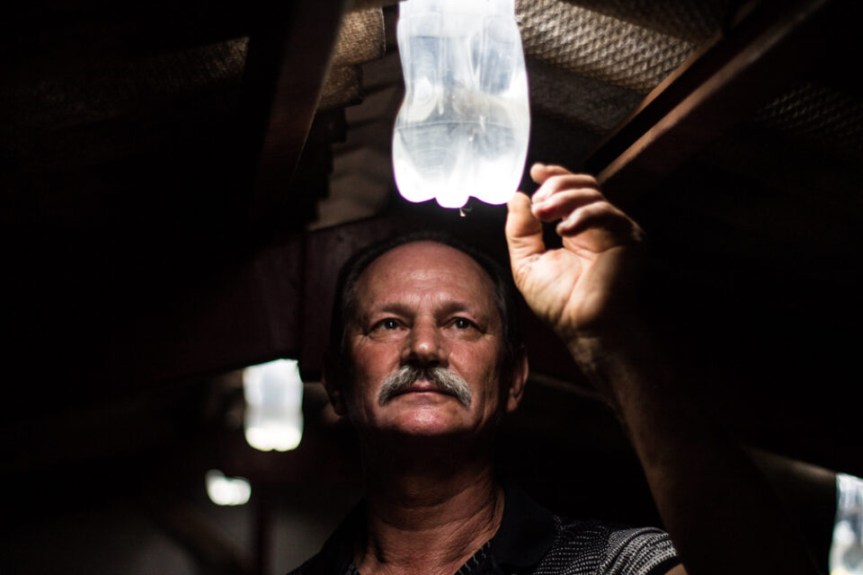 During a blackout in 2002, a mechanic in Brazil pushed a water bottle ...
