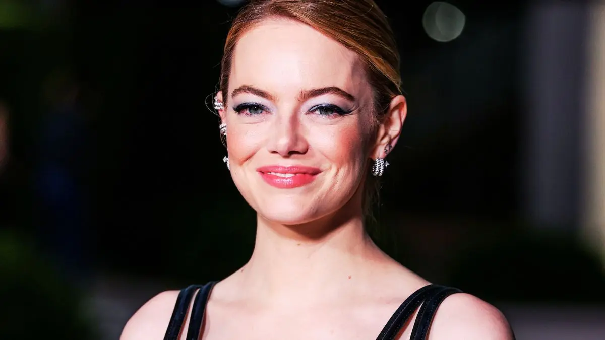 Emma Stone serves plunging power dressing in an electric blue mini set ...
