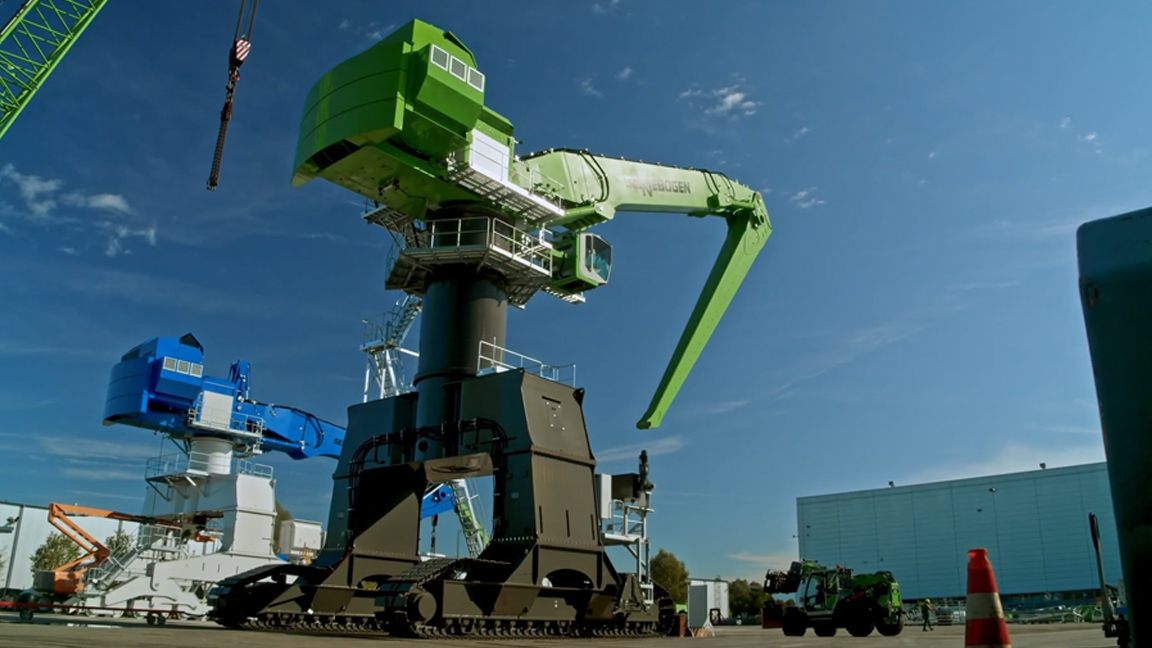 Giant material handler towers over the industrial yard