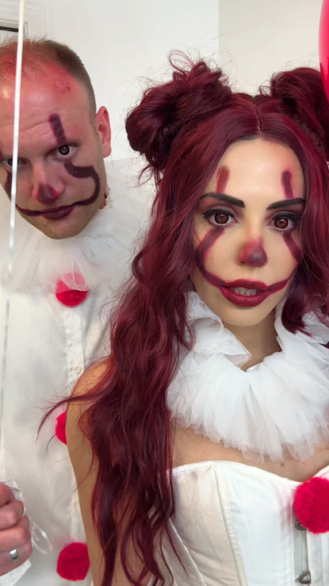 Pennywise inspired couples costume with creative styling