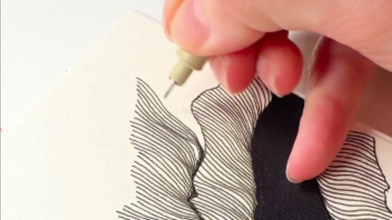 Black ink lines fill a sheet of paper to create a complete illustration