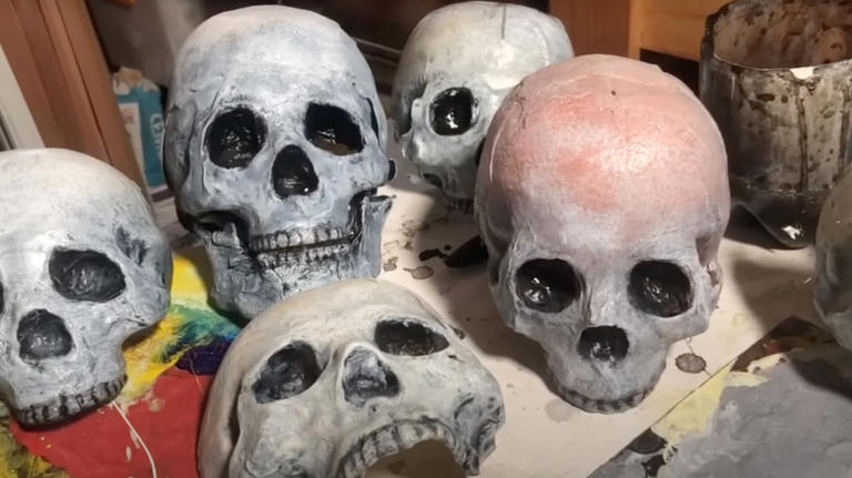 Upcycle milk jugs into DIY ghoulish skulls for unique Halloween decor