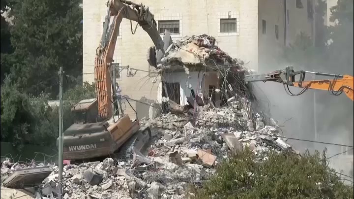 Residents search belongings after Jerusalem building demolished