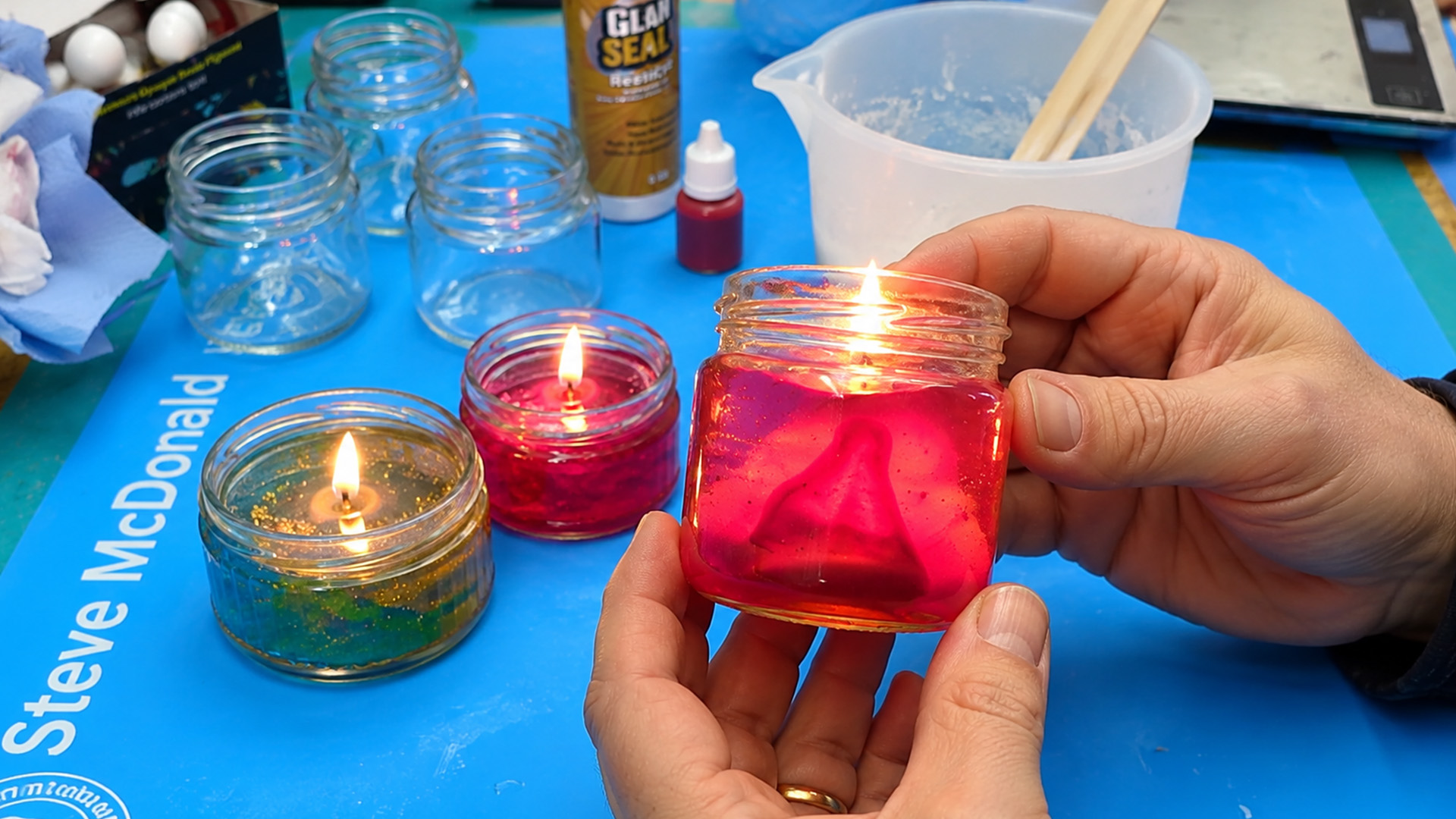 Old glass jars became glowing candle holders