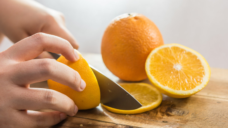Transform orange peels into a light-up Halloween garland with one ...
