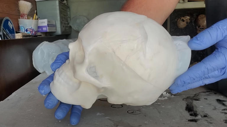 Upcycle milk jugs into DIY ghoulish skulls for unique Halloween decor