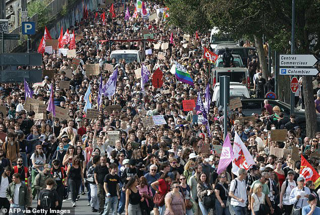 A street in Rennes is pictured packed with demonstrators carrying placards and flags