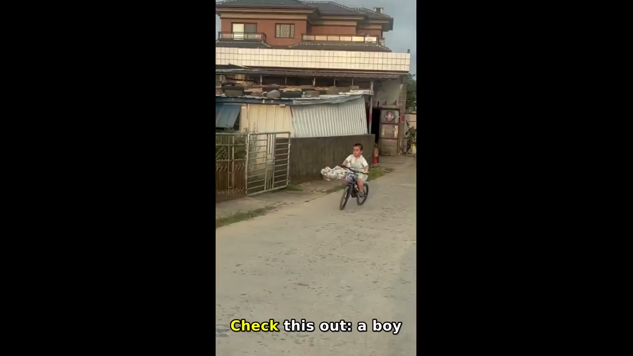 Boy wobbles and falls after peace sign on bicycle in Guangdong