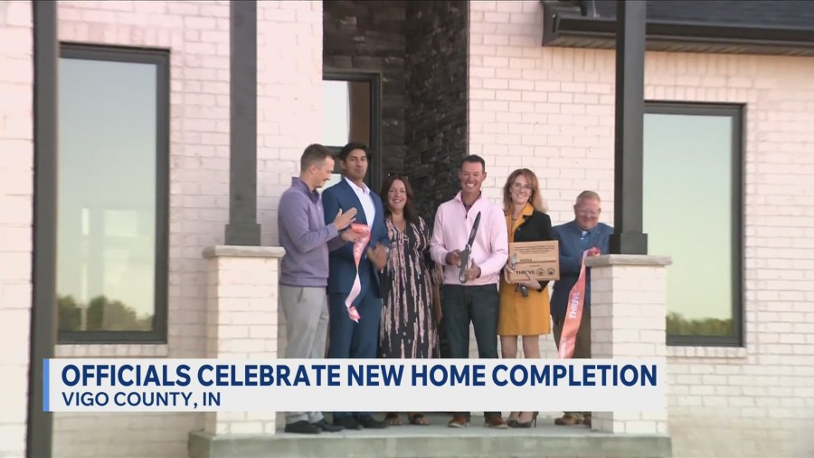 Local officials celebrate ribbon-cutting for new housing development