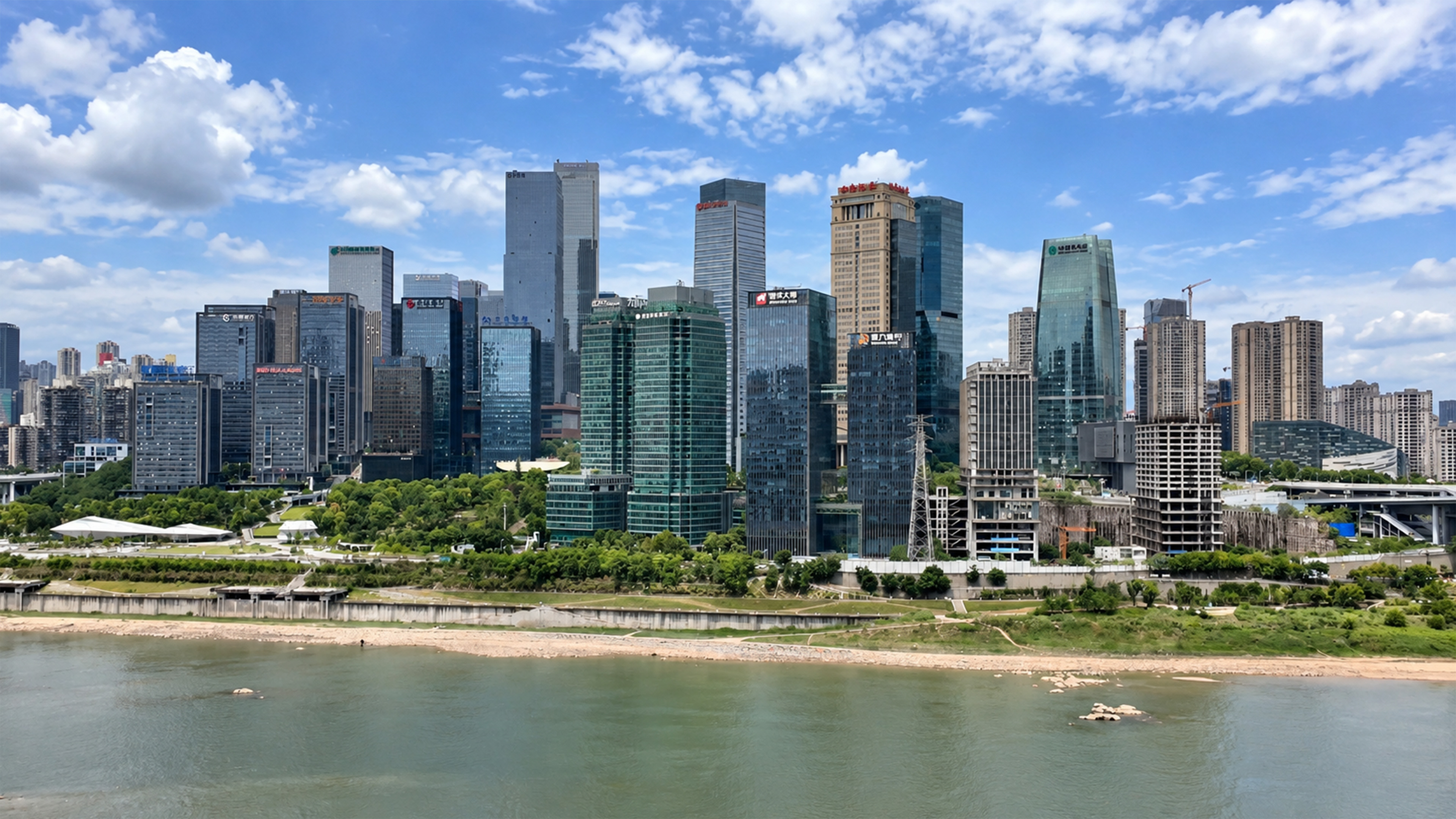 Glass towers and unfinished buildings share China’s riverfront