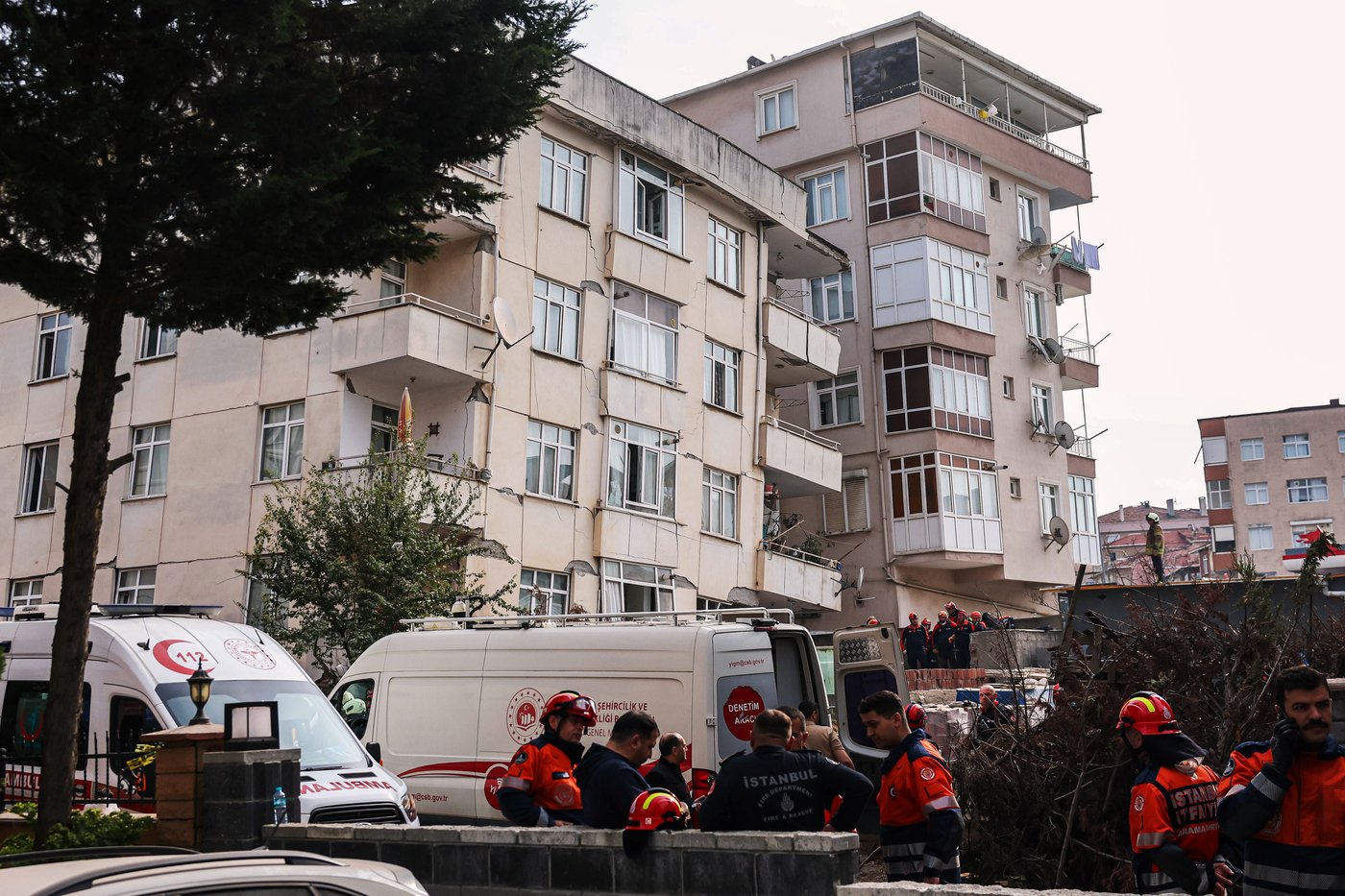A partial building collapse in Istanbul kills 2 and traps at least 2 more