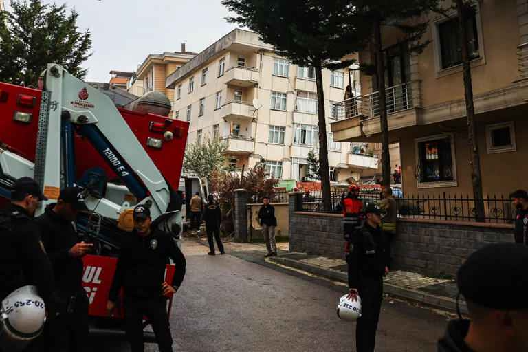 A partial building collapse in Istanbul kills 2 and traps at least 2 more