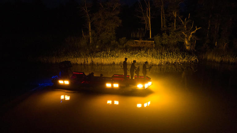 We spent a night hunting snakehead fish with bows and arrows