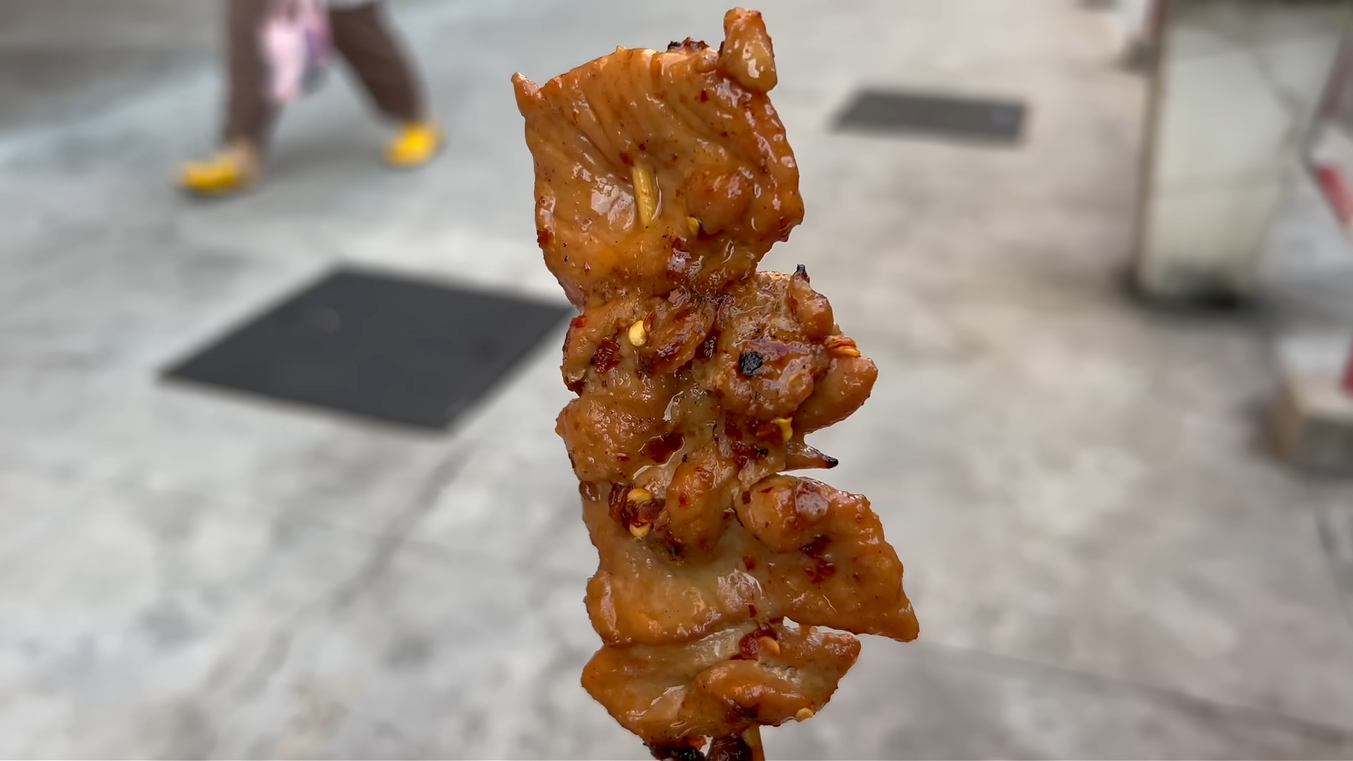 Starting a Thai breakfast adventure with moo ping grilled pork skewers