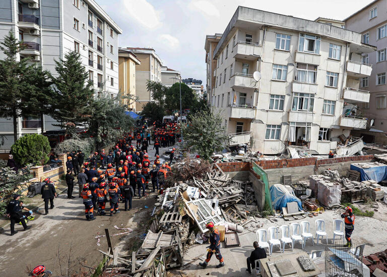 Partial building collapse in Istanbul kills two and traps at least ...