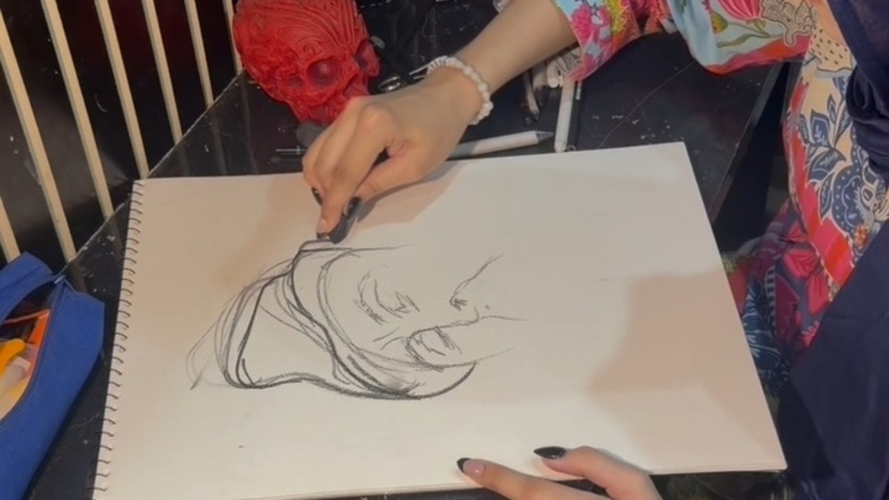 Intricate charcoal sketching process brings portrait to life