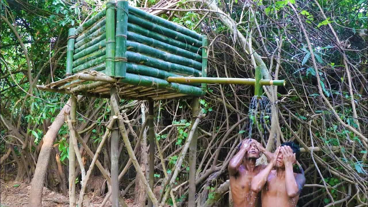 Watch these primitive builders create a working jungle shower tank