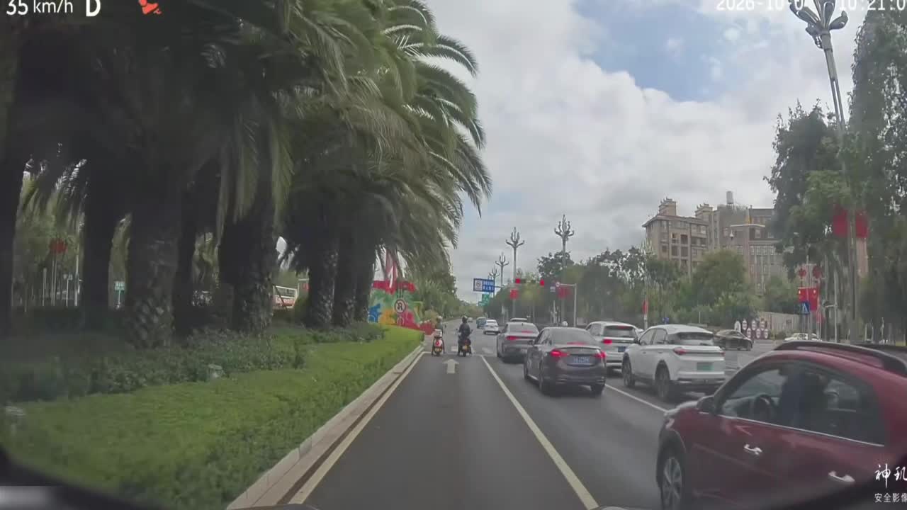 Motorcycle passenger falls as the rider starts moving at an ...
