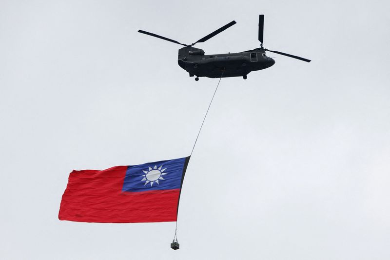 Giant Taiwan flag flies from helicopter for national day, defying Beijing