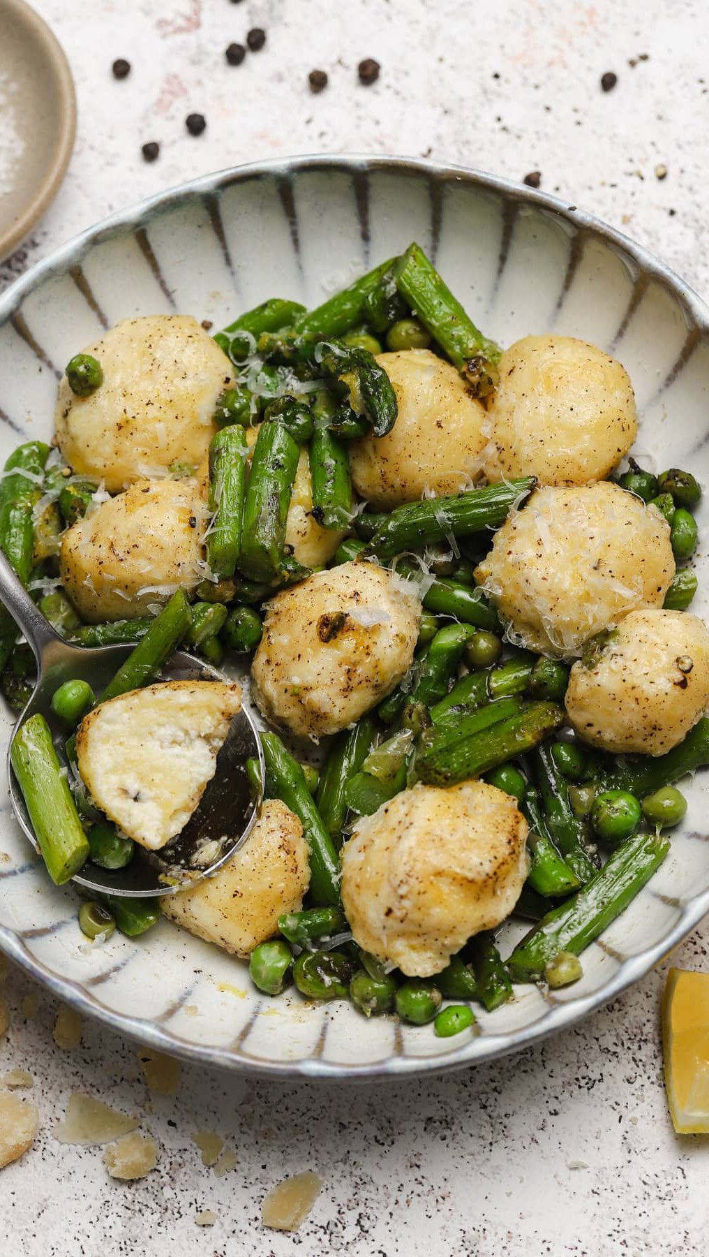 Soft ricotta gnudi with fresh spring vegetables