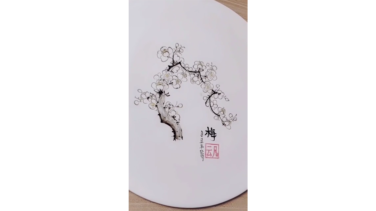 Drawing delicate plum blossoms with black ink, creating elegant ...