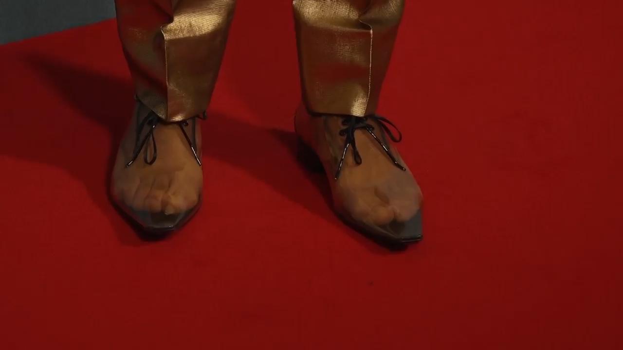 Alexander Skarsgård rocks transparent shoes to premiere
