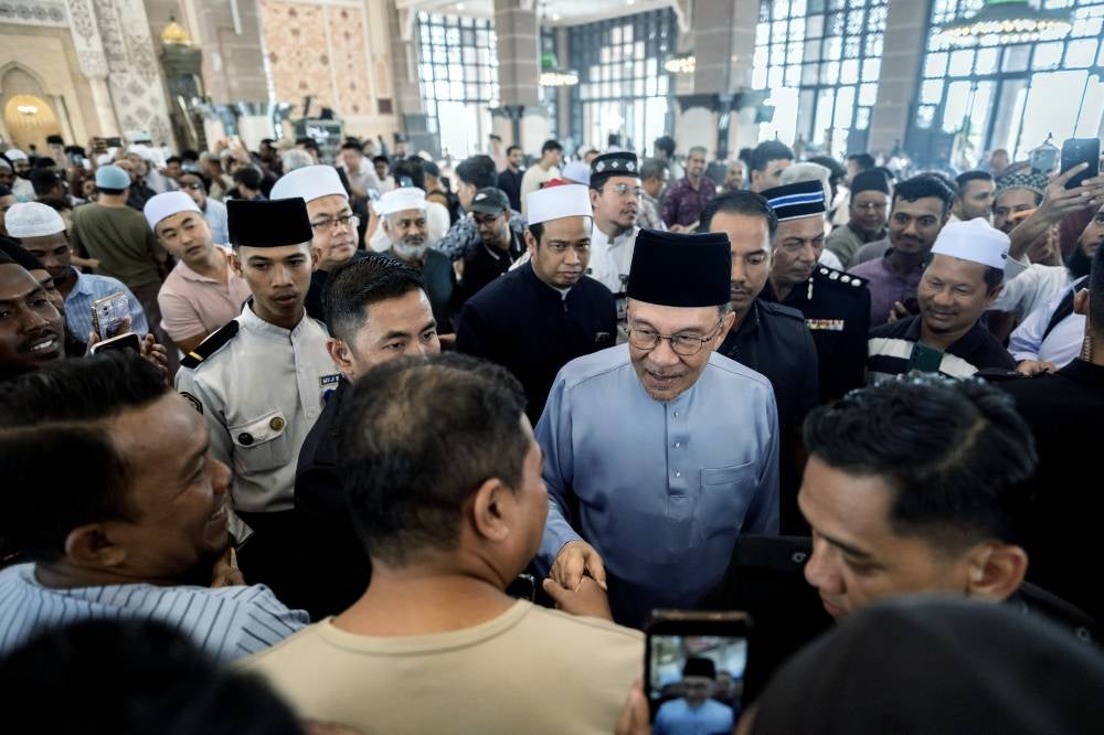 Anwar fields suggestions from worshippers after Friday prayers ahead of ...