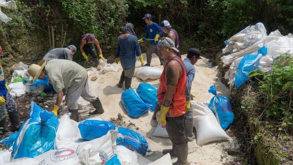 Unfit for consumption: Bantayan disposes of 178 sacks of spoiled rice