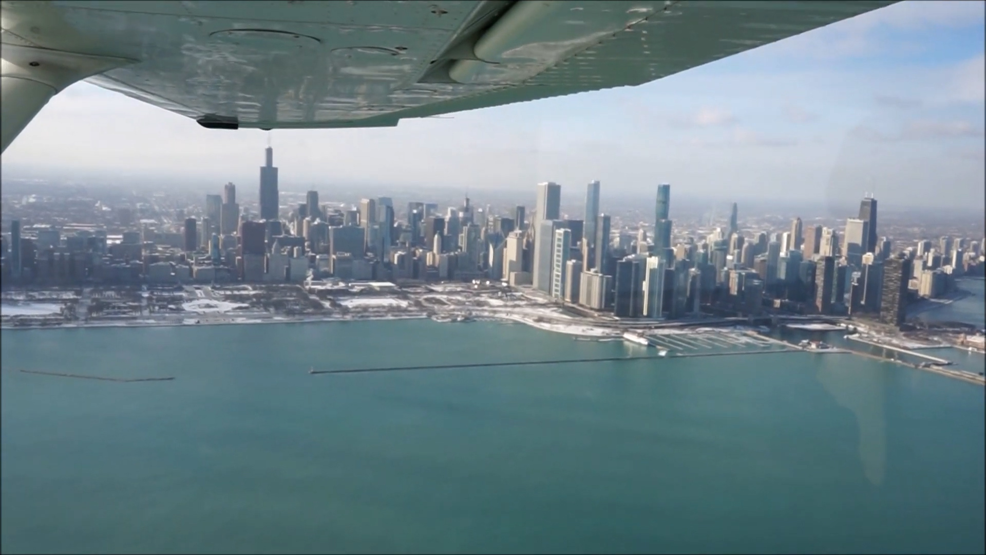 Low over the city and Chicago Midway in a Cessna 172 while ATC talks on ...