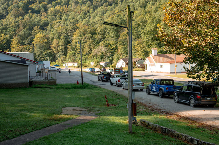 The line of vehicles started forming early in the morning at a drive-up food distribution in Dunlow, W.Va., on Sept. 16. (Mike Belleme for NBC News)