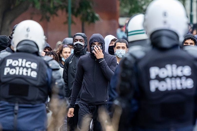 Police and protesters clash in Brussels as anti-austerity rally ...